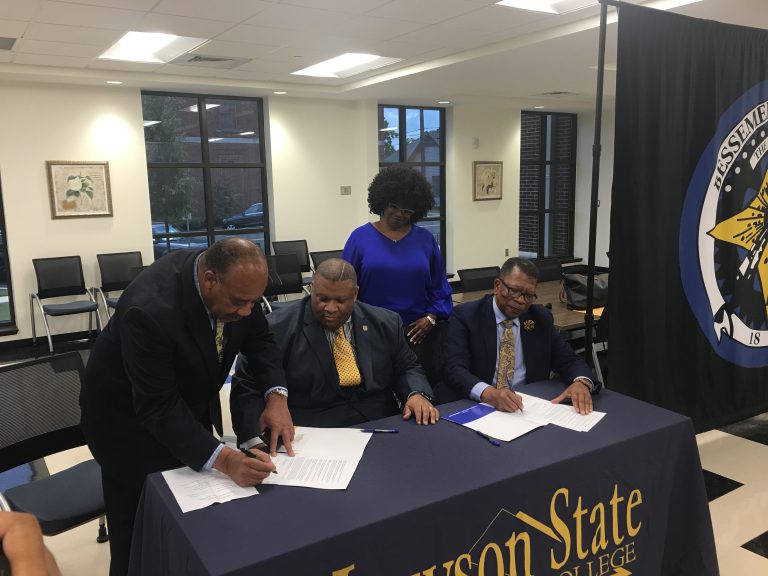 Municipal Court Judge Aaron Killings (left) and Vice VP of Instructional Services for Lawson State Dr. Bruce Crawford (far right) sign a memorandum of understanding for the A.B.C. initiative on Thursday, August 1, 2019 at Bessemer City Hall while Chief Magistrate Dr. Maurice Muhammad (middle seated) and Chief Court Clerk Gwen Horn (standing) look on.