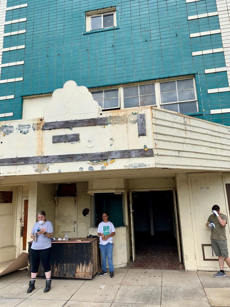 Volunteers from the Bessemer Historic Society help clean the Lincoln Theater